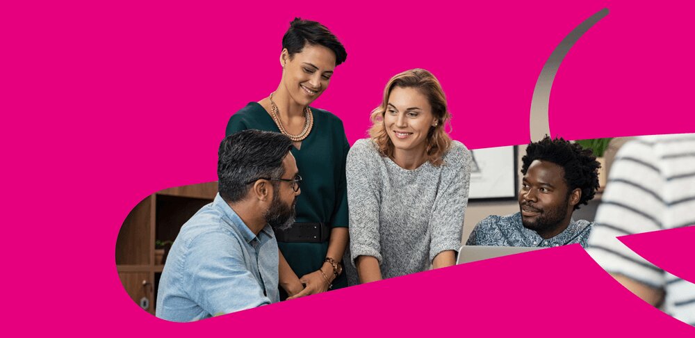 Happy team members collaborating in a at work, focusing on digital transformation and ERP implementations.