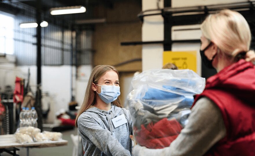 Young woman volunteering for a charity.